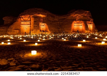 Tombs at the Mada'in Saleh (Hegra) archeological site lit up after dark, north west Saudi Arabia Royalty-Free Stock Photo #2254383457