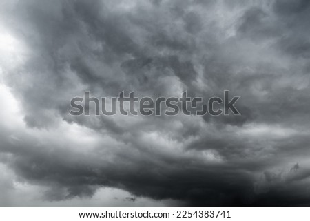 dark clouds make sky in black. Heavy rain thunderstorm . Pattern of clouds overcast predict tornado, Hurricane or thunderstorm and rainy.