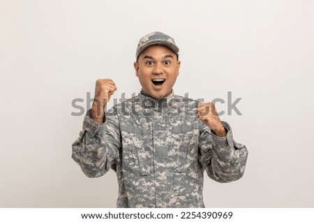 Happy Asian man special forces soldier standing against in studio isolated. Commander Army soldier military defender of the nation in uniform standing on white background.