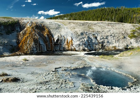 Sunny landscape of a geysers valley. Yellowstone National Park