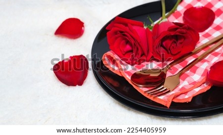 Dinner set plate dish spoon and fork in Valentines day table setting red roses on white carpet background. Love Valentine 's greeting card - Image.