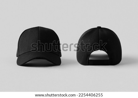 Black baseball caps mockup on a grey background, front and back side. Royalty-Free Stock Photo #2254406255