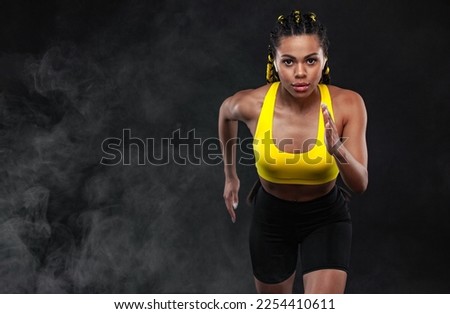 Download picture for the music collection for running. Sprinter run. Woman running on black background. Fitness and sport motivation. Runner concept.