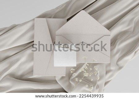 Luxury feminine wedding mockup with blank greeting card and gypsophila flowers. Satin material on white background. Empty place.3d rendering