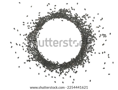Black sesame seeds pile, round isolated on white, top view Royalty-Free Stock Photo #2254441621