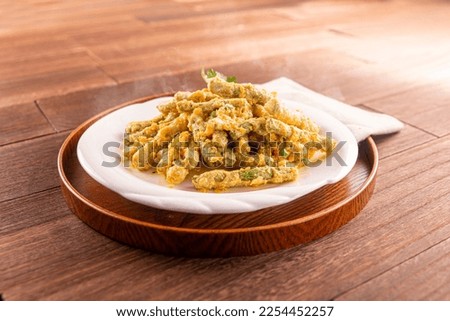 Golden Crispy Kidney Beans served dish isolated on wooden table top view of Hong Kong food