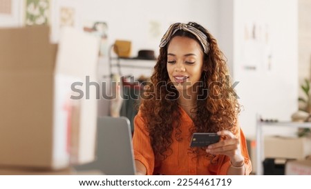 Credit card, shopping and black woman on the internet with a laptop in an office at work. Happy business owner making an online payment for stock for her small business with a card and computer