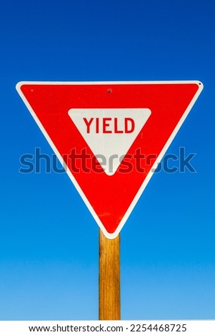 yield Sign at the highway with blue sky