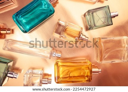 Top view, flat lay of a set of perfume bottles on a on a colorful background Royalty-Free Stock Photo #2254472927