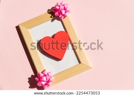 wood frame with Valentines Day heart decor and calendar. Copy space.Valentine gift diy hobby. Happy lovers day card