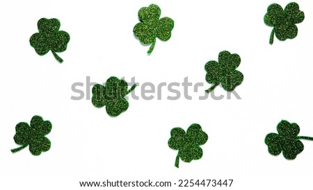Happy St. Patrick's Day banner.Holiday background.St Patricks Day frame against a white background. Flat lay shamrocks.Copy space.Patrik's day banner Royalty-Free Stock Photo #2254473447