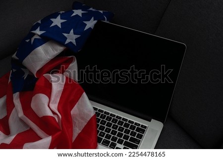 Internet and network security. Computer with binary computer code and American flag Royalty-Free Stock Photo #2254478165