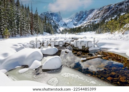 View of Dream Lake frozen during winter at Rocky Mountain National Park near Estes Park Colorado Royalty-Free Stock Photo #2254485399
