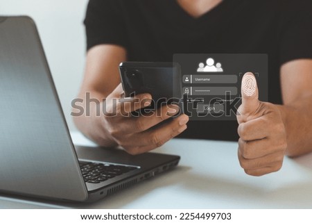 Businessman use fingerprint identification login to access personal financial data. E-KYC (electronic know your customer) concept,biometrics security,innovation technology against digital cyber crime. Royalty-Free Stock Photo #2254499703