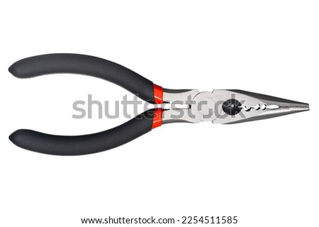 Needle nose pliers. Wire cutter or flush nippers. Universal long nose pliers for electric wire. Professional tools for metal construction. Mechanic instrument for workshop, repairing works.  Royalty-Free Stock Photo #2254511585