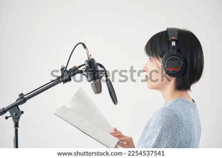 Asian narrator working at the studio