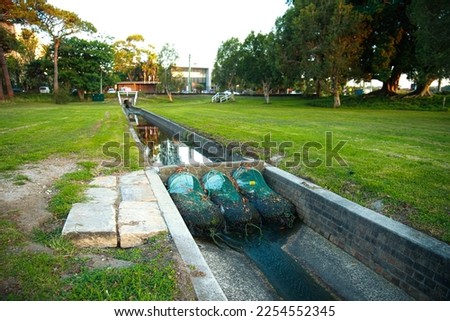 Drainage nets catching run off in sydney australia trash trap for stormwater Royalty-Free Stock Photo #2254552345