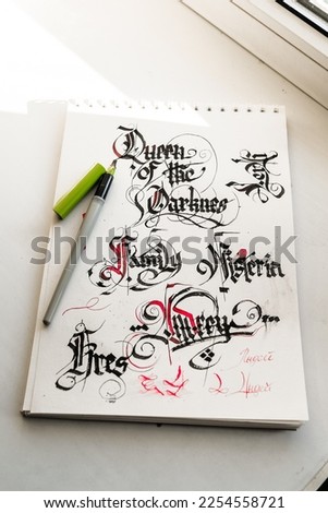 Gothic font Pen lettering on paper Background