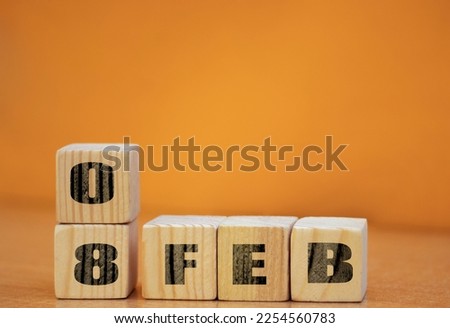 Cube shape calendar for February 08 on wooden surface with empty space for text, new year Wooden calendar with date, January cube calendar on wooden surface with copy space. Royalty-Free Stock Photo #2254560783