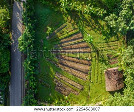 wide shot aerial permaculture garden with small barn for compose processing in Simeulue Aceh Indonesia Royalty-Free Stock Photo #2254563007