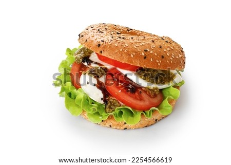 Sandwich, toast, bagel with mozzarella cheese, pesto sauce, tomatoes. Caprese Sandwich isolated on white background with clipping path, cut out. Royalty-Free Stock Photo #2254566619