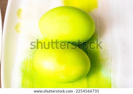 Painted eggs on the table after painting, a symbol of Easter, traditions to paint eggs in different colors on the holiday of Orthodox Easter. High quality photo