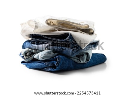 Stack of different colors jeans on white background for Shop, sale concept.