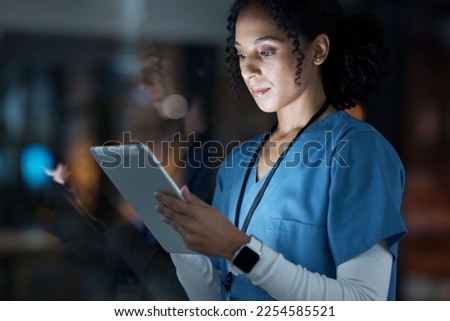 Medical, research and night with doctor and tablet for planning, medicine and schedule. Technology, review and digital with black woman reading report for healthcare, science and life insurance news Royalty-Free Stock Photo #2254585521