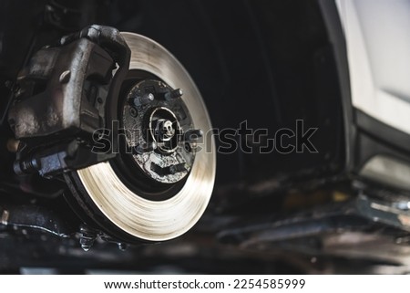 Closeup disc brake of vehicle for repair - Tire replacement car brake repairing. High quality photo