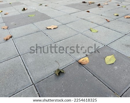 Tile flooring with deciduous leaves