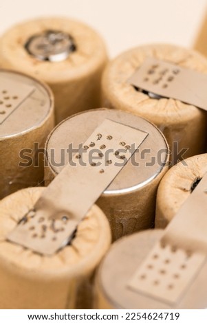 Bundle of Soldered Ni-Mh Rechargeable Batteries  Placed Together Over Beige.Vertical image Royalty-Free Stock Photo #2254624719