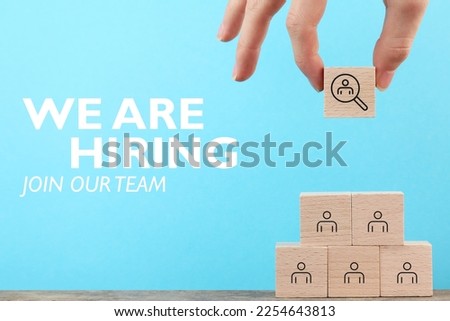 Hire Team Job Concept, We are hiring, Outstanding talent stand out from the crowd and different, Background, Step by step, Business, Hand holding wood cube, blue copy space