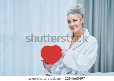 Picture of mature young woman with heart