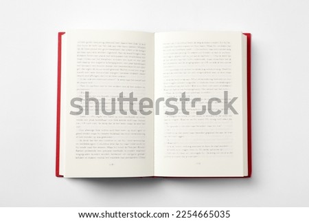 Open book on white background, top view Royalty-Free Stock Photo #2254665035
