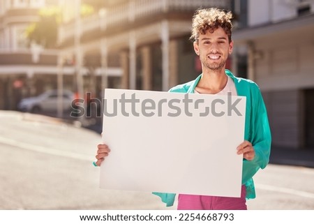 Mockup, portrait and man with board, street and protest for human rights, social change and equality. Young person, male and protester with blank card, marching and in city with smile and activist
