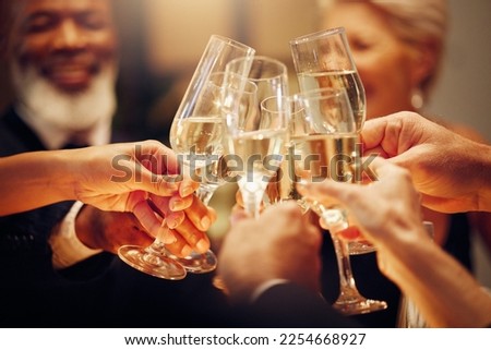 Success, people and dinner with toast, champagne and elegant team, party and celebration together. Friends, closeup and cheers for achievement, wine glasses and fine dining at gala event and luxury Royalty-Free Stock Photo #2254668927