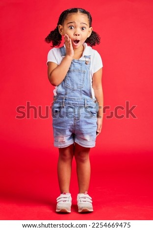 Surprise, wow face and portrait of girl on red background for with omg, comic and shock facial expression. Kids fashion, mockup and cute girl in studio for promotion, sale and discount announcement