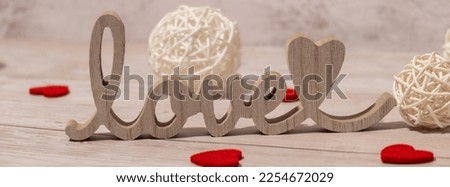 Banner Wooden word love with heart romance. Minimal concept of greeting card for Valentine's Day, Mother's Day, Women's Day Festive holiday card concept. Wedding anniversary decor.