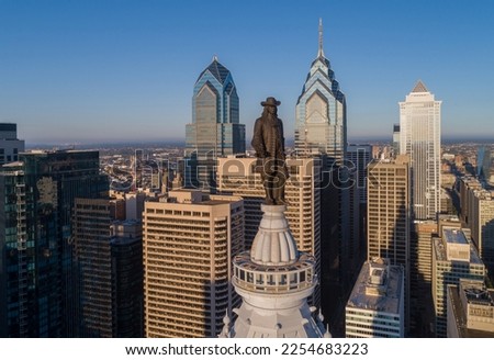Statue of William Penn. Philadelphia City Hall. William Penn is a bronze statue by Alexander Milne Calder of William Penn. It is located atop the Philadelphia City Hall in Philadelphia, Pennsylvania. Royalty-Free Stock Photo #2254683223