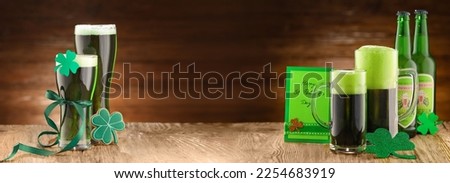 Banner with green beer on wooden background. St. Patrick's Day celebration 