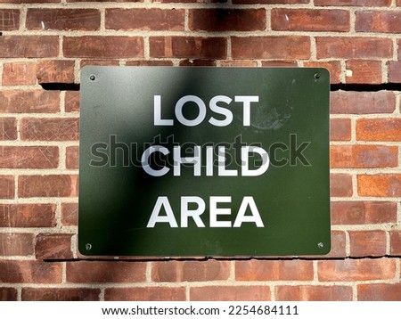A sign that says "Lost Child Area".