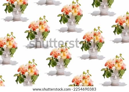 Fresh bunch of colorful flowers in human head shaped vases on  white background. Creativity, nature, spring and summertime concept. Royalty-Free Stock Photo #2254690383