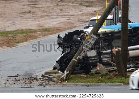 View of flipped truck after hitting a utility pole. No one hurt! Royalty-Free Stock Photo #2254725623