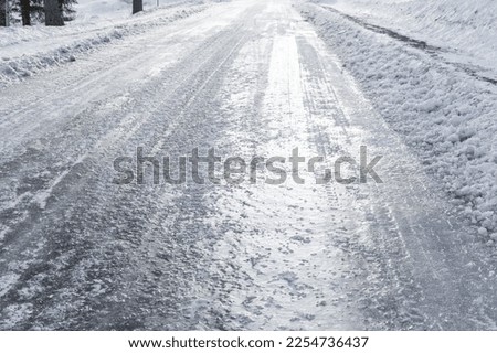 Icy road in the winter Royalty-Free Stock Photo #2254736437