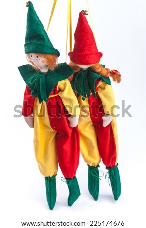 Textile dolls clothed up in colorful costumes. Couple of clowns.