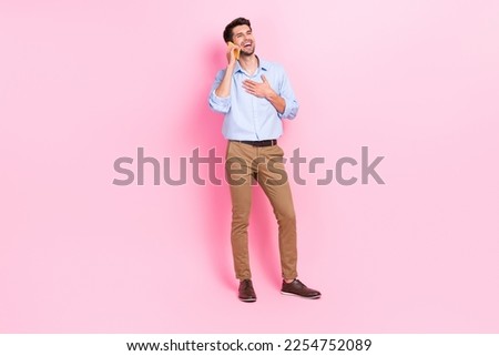 Full body size photo of young entrepreneur attractive man wear formal outfit talking laugh funny joke smart phone user isolated on pink color background