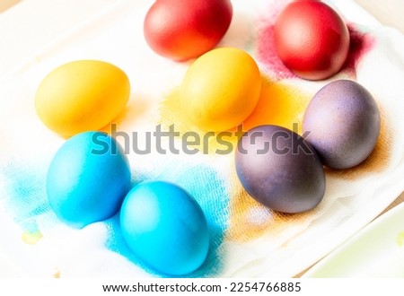 Painted eggs on the table after painting, a symbol of Easter, traditions to paint eggs in different colors on the holiday of Orthodox Easter. High quality photo