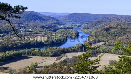 Ariel view of river with small town Royalty-Free Stock Photo #2254771863