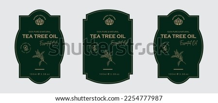 Tea tree oil label design cosmetic products label for skin care and beauty, herbal ingredients. Tea tree Labels with sketches, and package emblem. Green gold premium vector illustration. Royalty-Free Stock Photo #2254777987