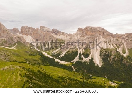 Drone photography of dolomite mountain peaks during summer day.